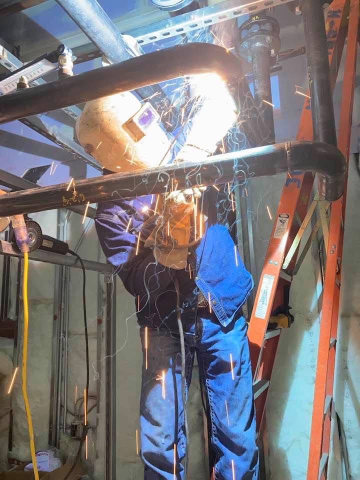 Field welding in confined industrial workspace