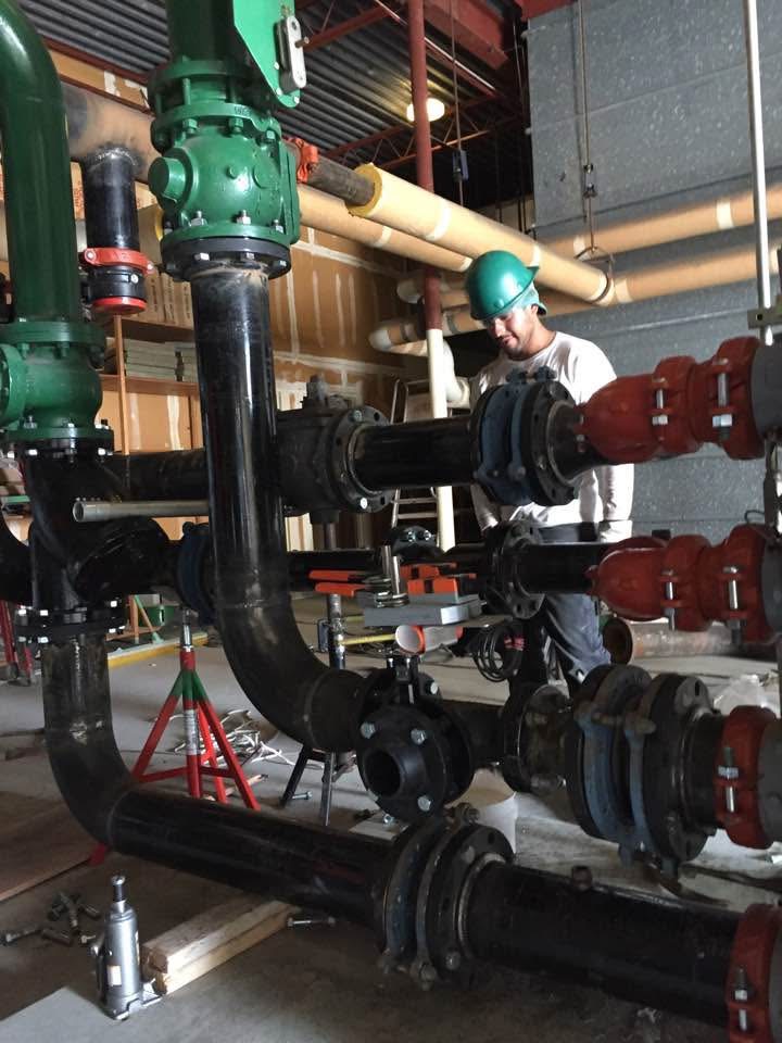 Installed piping and valves inside a mechanical room