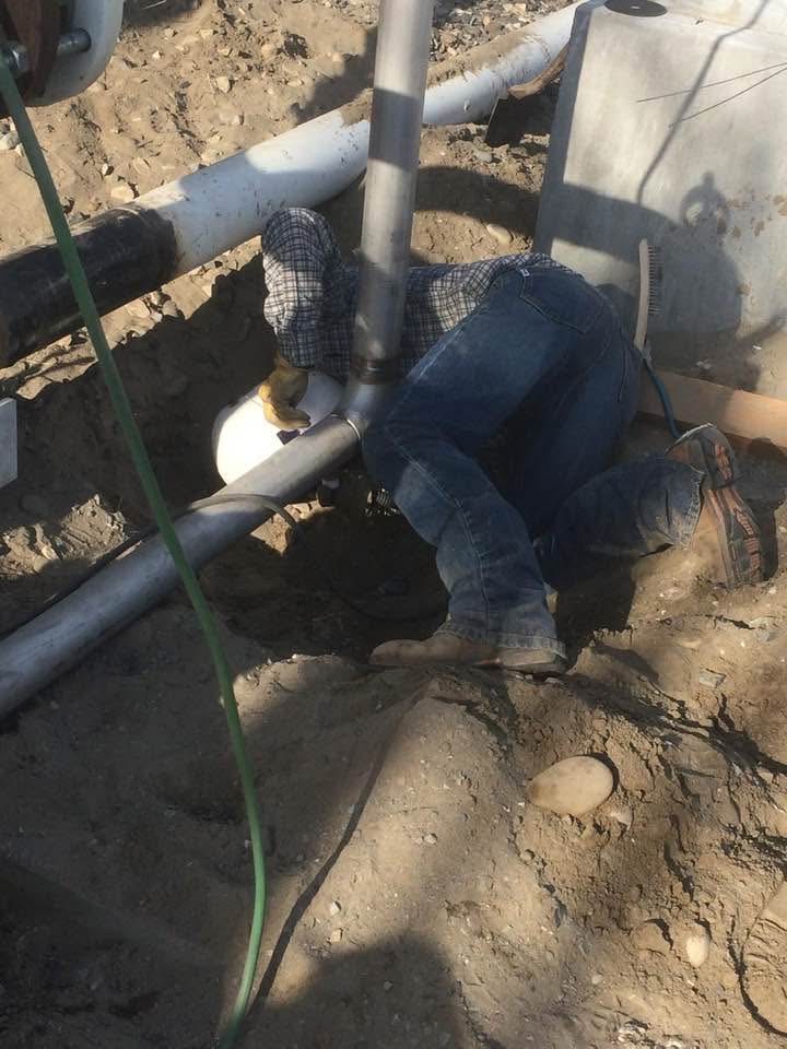 Crew performing trench and underground utility work