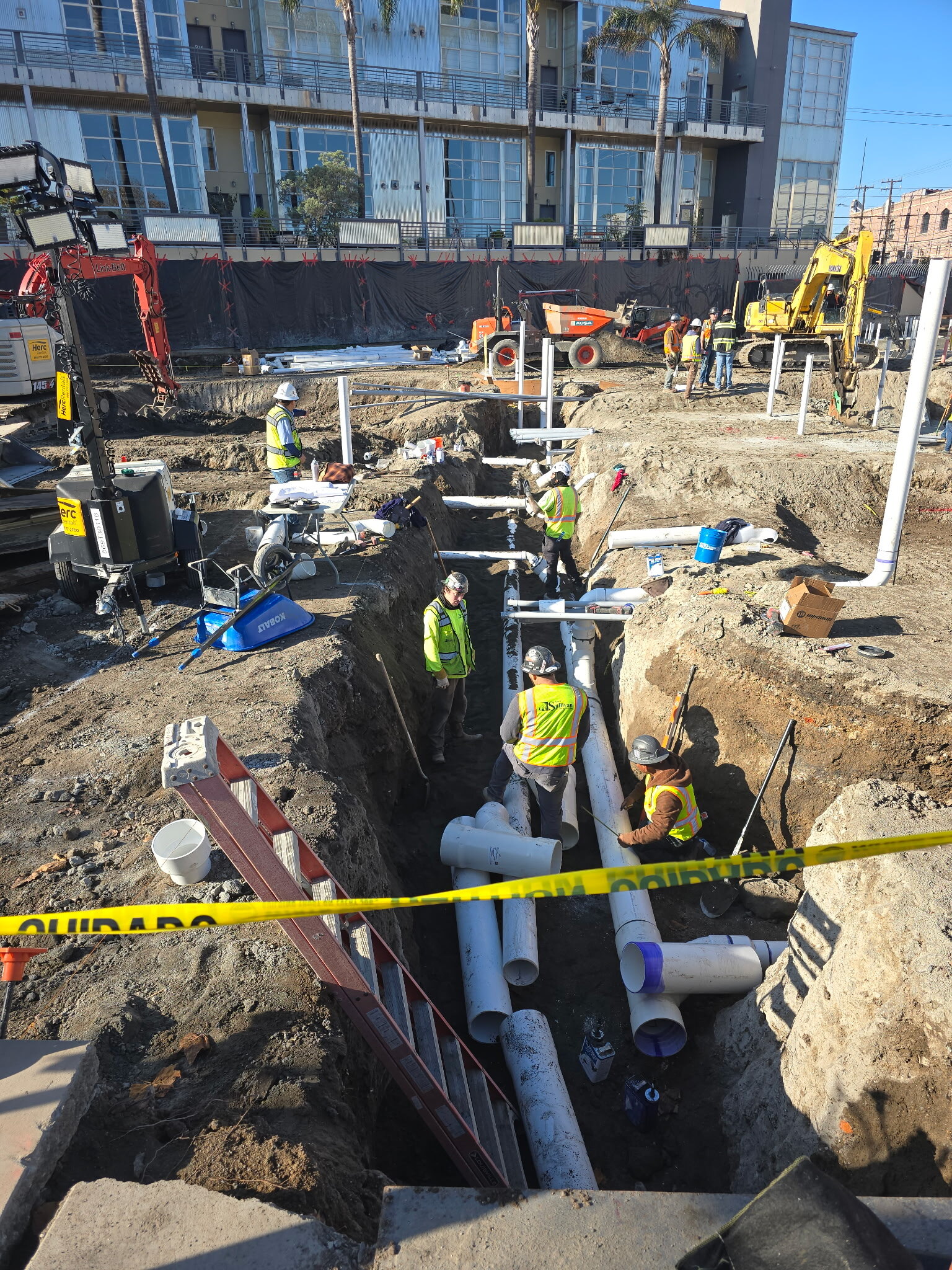 Field crew installing underground utility systems